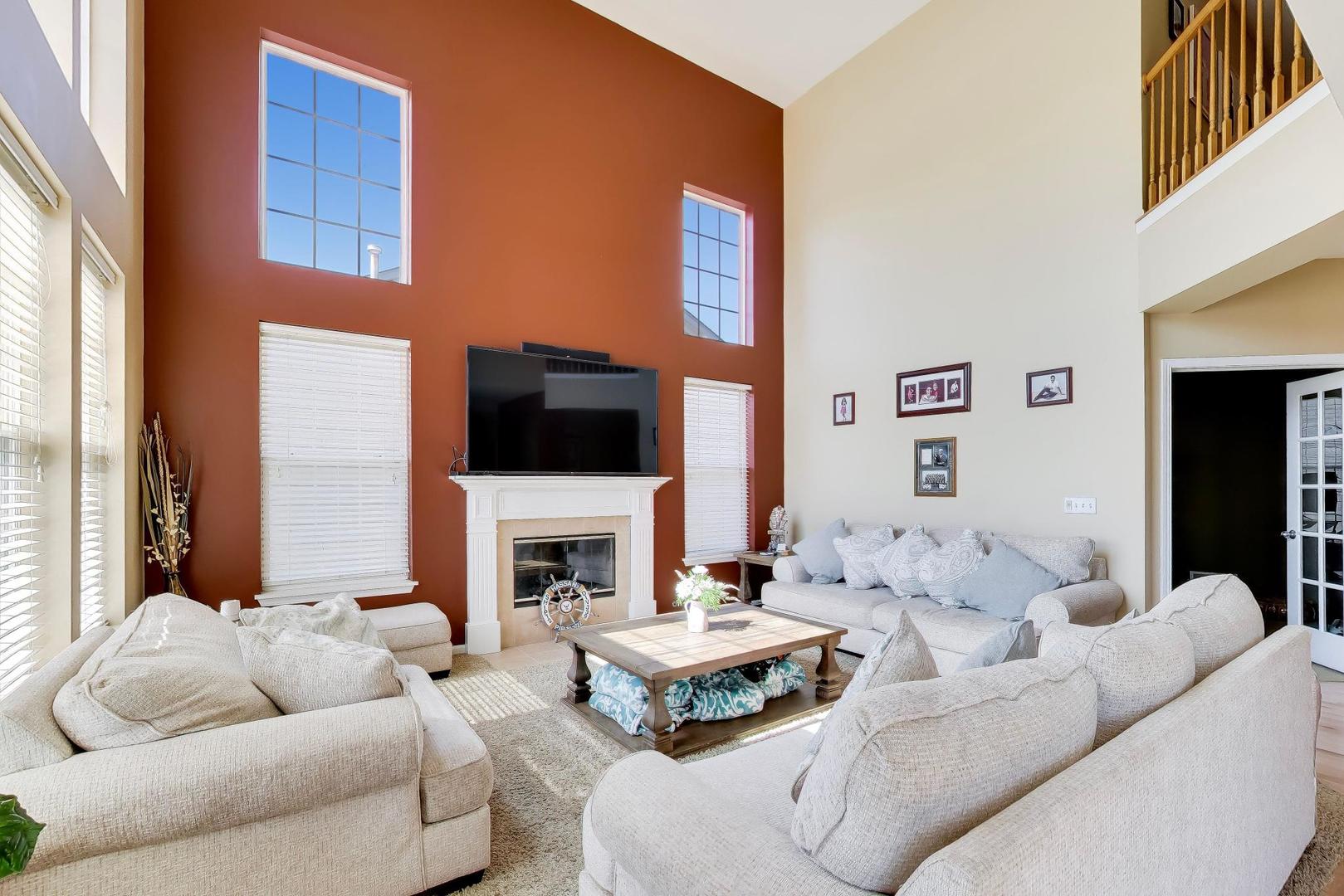 343 Copper Springs Lane Elgin, IL 60124 - Photo 10 of 50 a living room with furniture flat screen tv and a fireplace