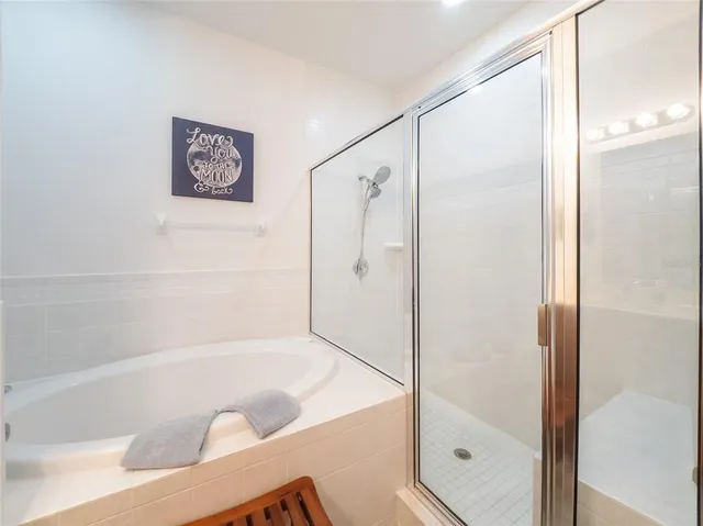a bathroom with a bathtub and a shower