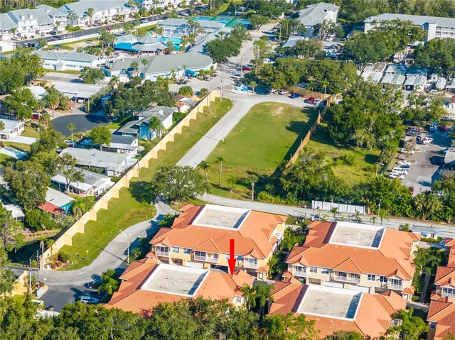 an aerial view of a house with a swimming pool