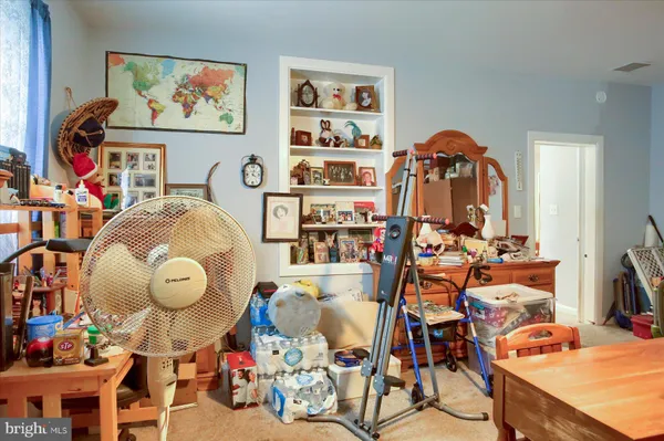 a room with gym equipment and equipment