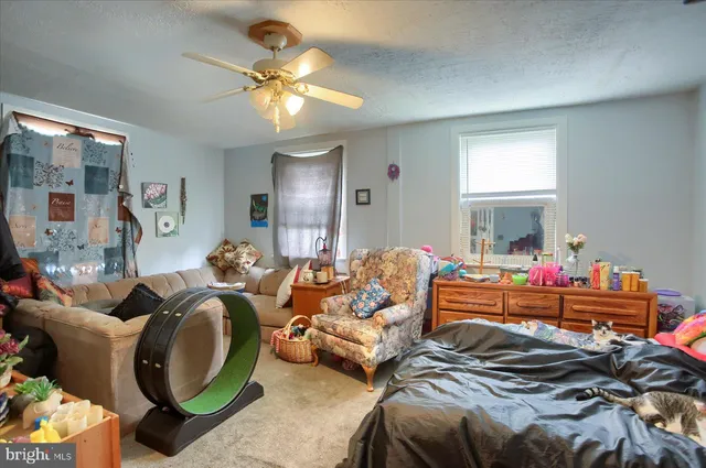 a bed room with bed and a chandelier