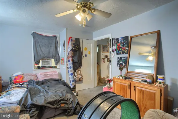 a bedroom with furniture and a chandelier