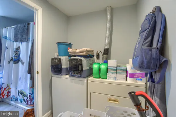 a bathroom with a sink and a shower curtain