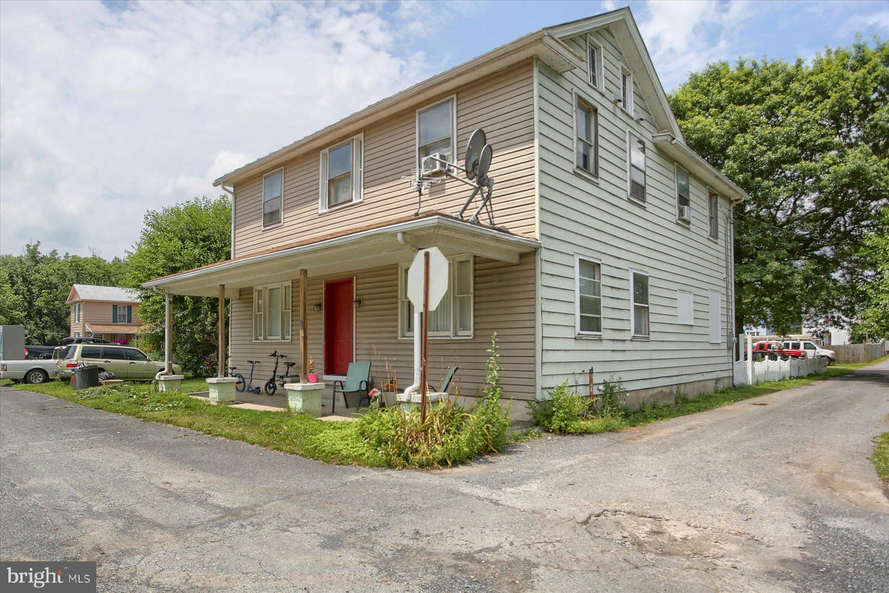 46 Front Street New Buffalo, PA 17069 - Photo 2 of 28 a front view of a house with garden