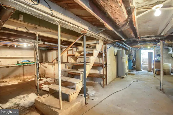 a view of a room with wooden chairs