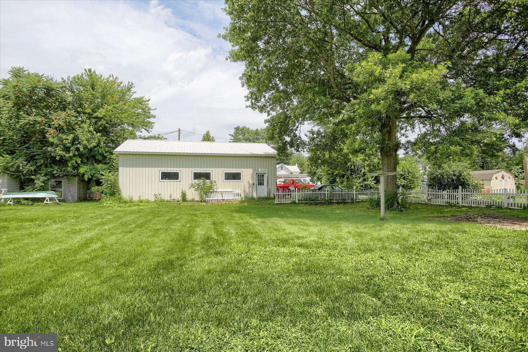 46 Front Street New Buffalo, PA 17069 - Photo 28 of 28 a view of a house with a big yard and large trees