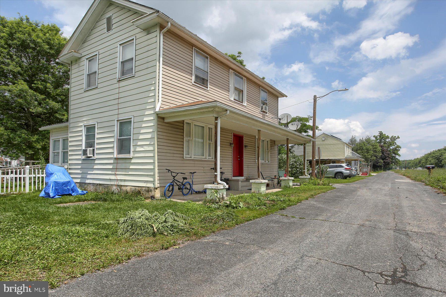 46 Front Street New Buffalo, PA 17069 - Photo 3 of 28 a front view of house with yard and green space