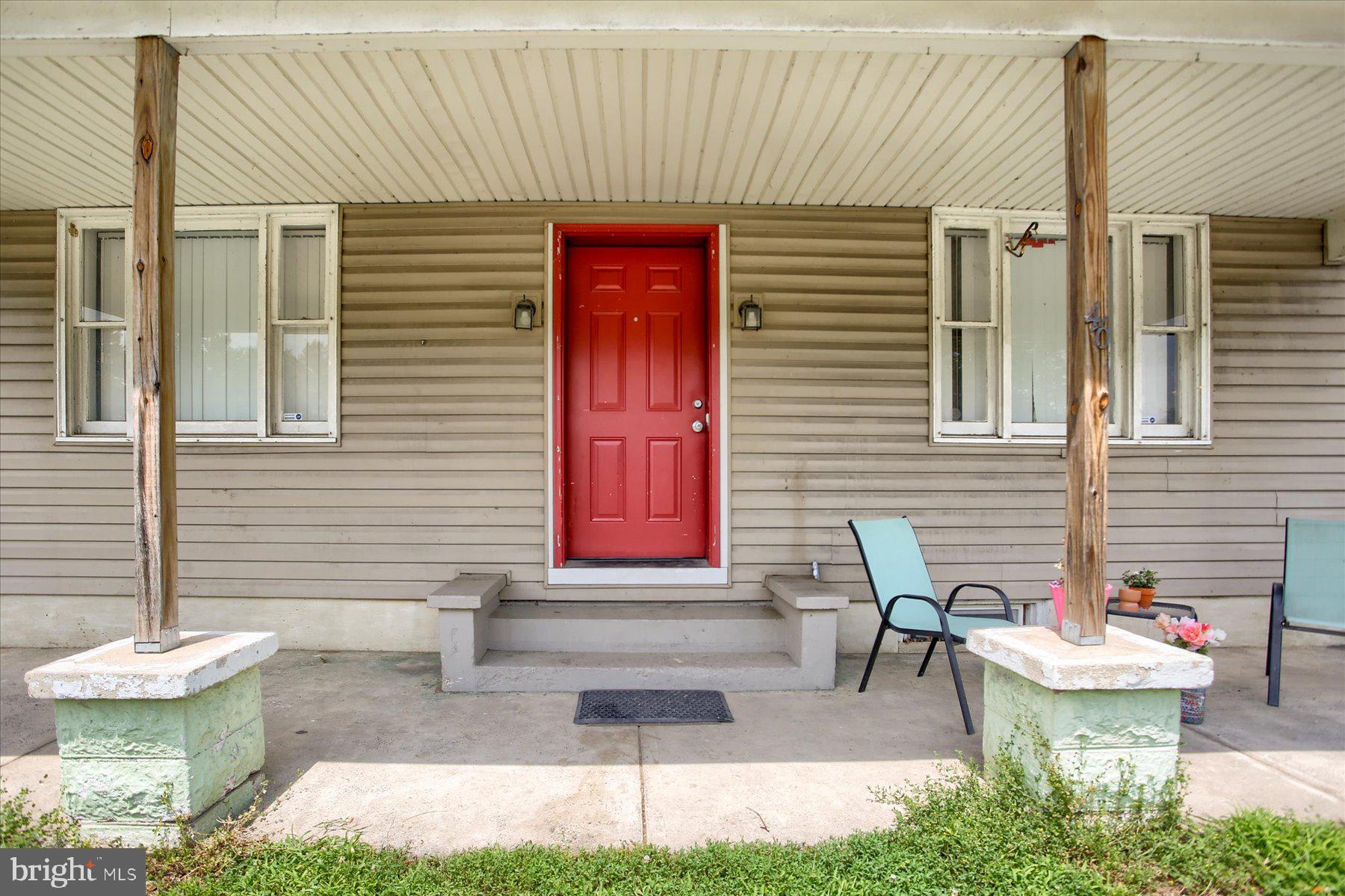 46 Front Street New Buffalo, PA 17069 - Photo 4 of 28 a front view of a house with porch and chairs