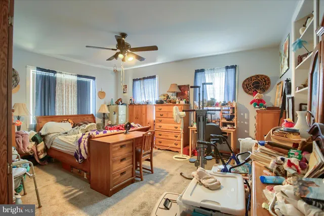 a bed room with a bed and a mirror