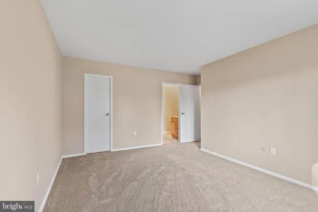 a view of an empty room and entryway