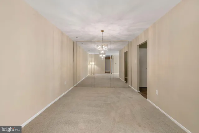 a view of a hallway with an entryway