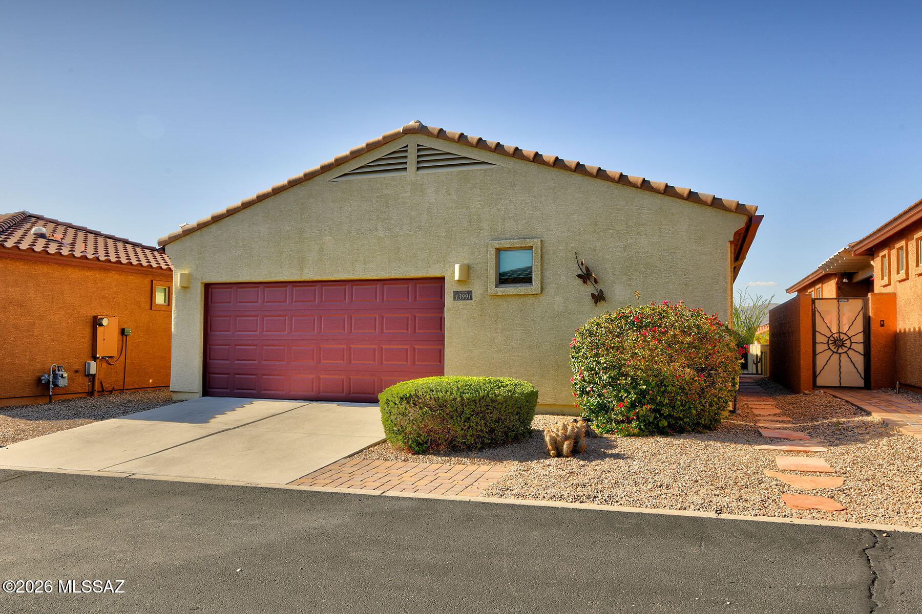 13991 East Cheavront Loop Vail, AZ 85641 - Photo 26 of 47 a front view of a house with a yard