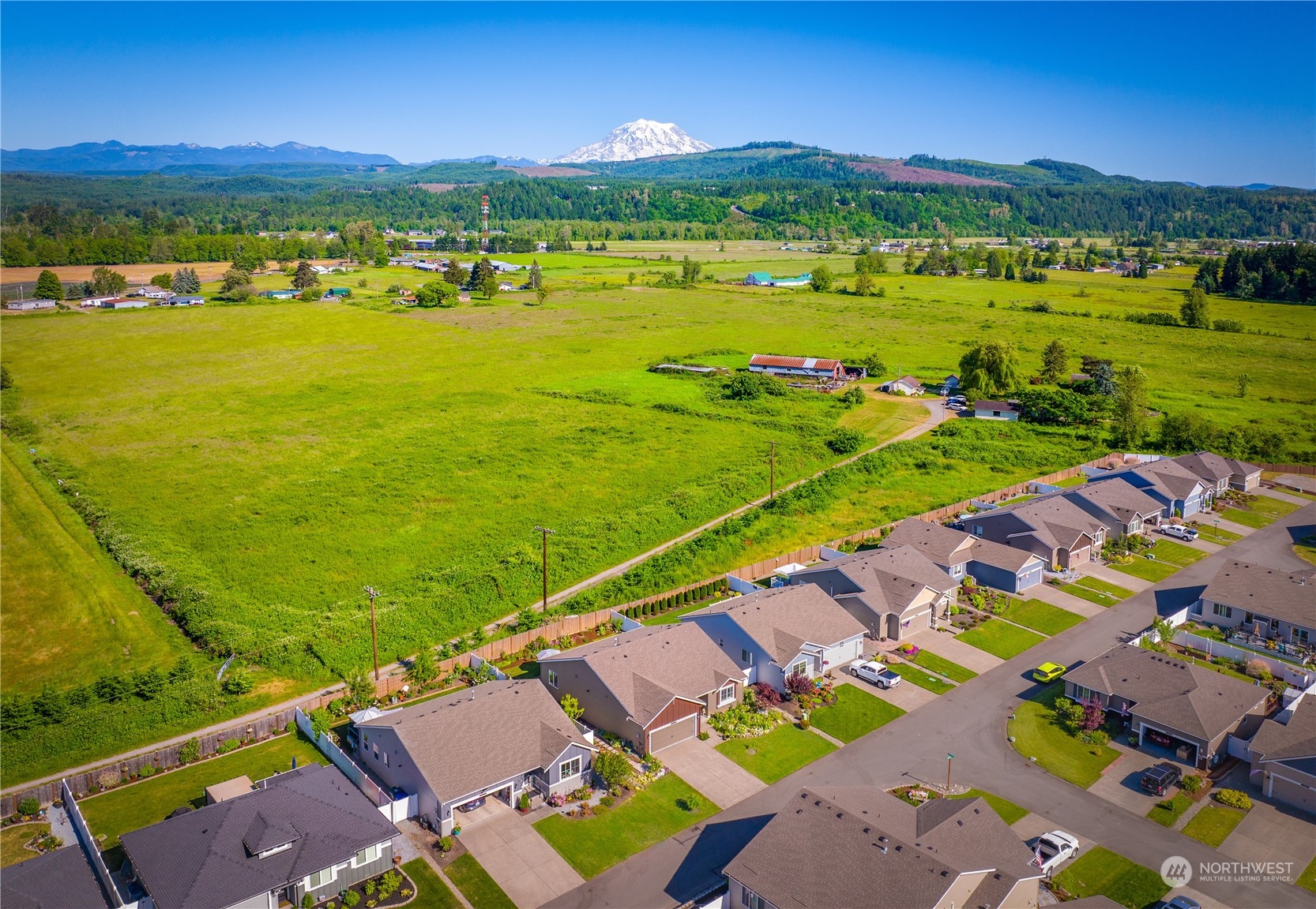 832 Maple Lane Southwest, Unit 59 Orting, WA 98360 - Photo 25 of 32 a view of a city and an ocean view
