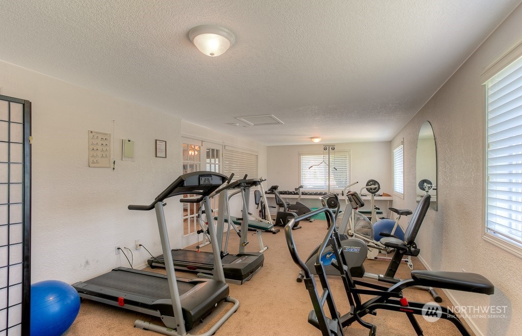 832 Maple Lane Southwest, Unit 59 Orting, WA 98360 - Photo 28 of 32 a view of a room with gym equipment