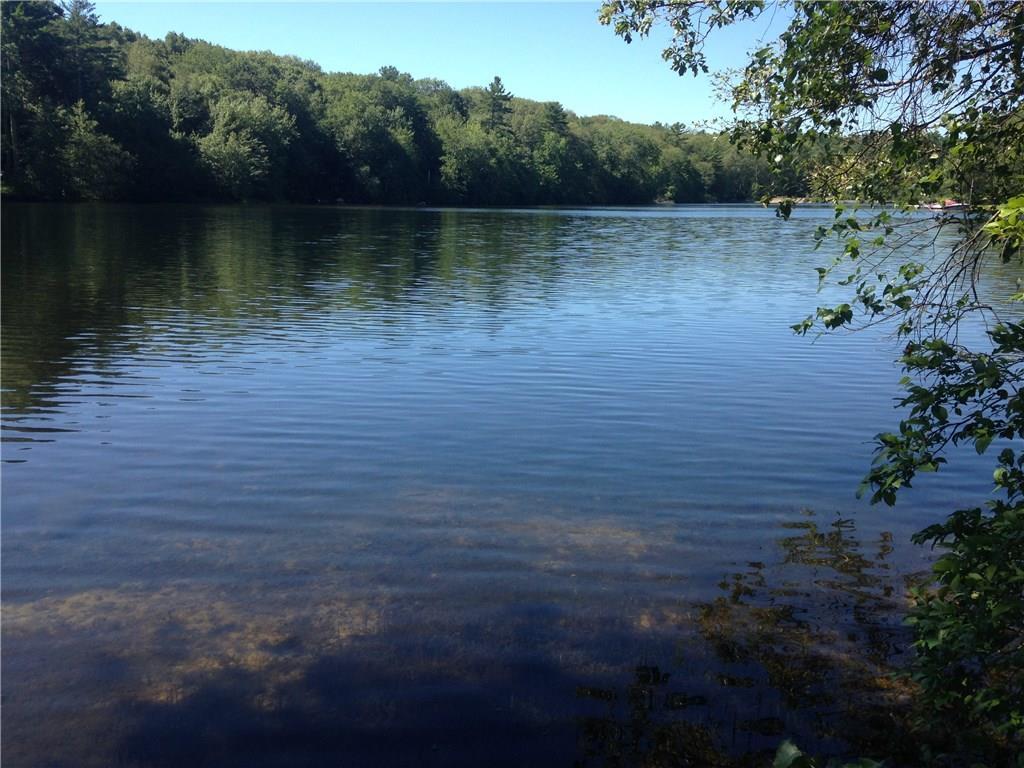 a view of a lake with a yard