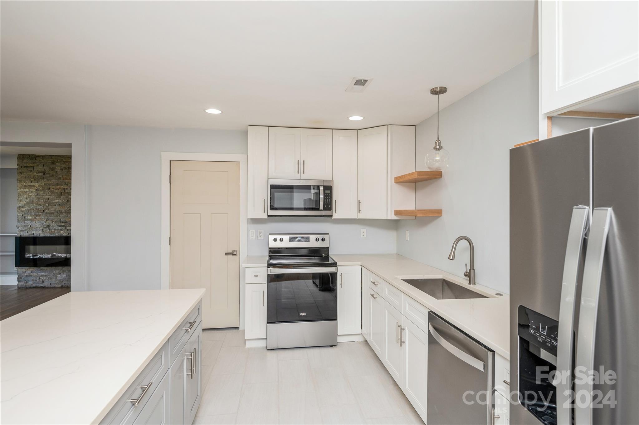 2124 Tyvola Road Charlotte, NC 28210 - Photo 16 of 38 a kitchen with stainless steel appliances a refrigerator sink and microwave