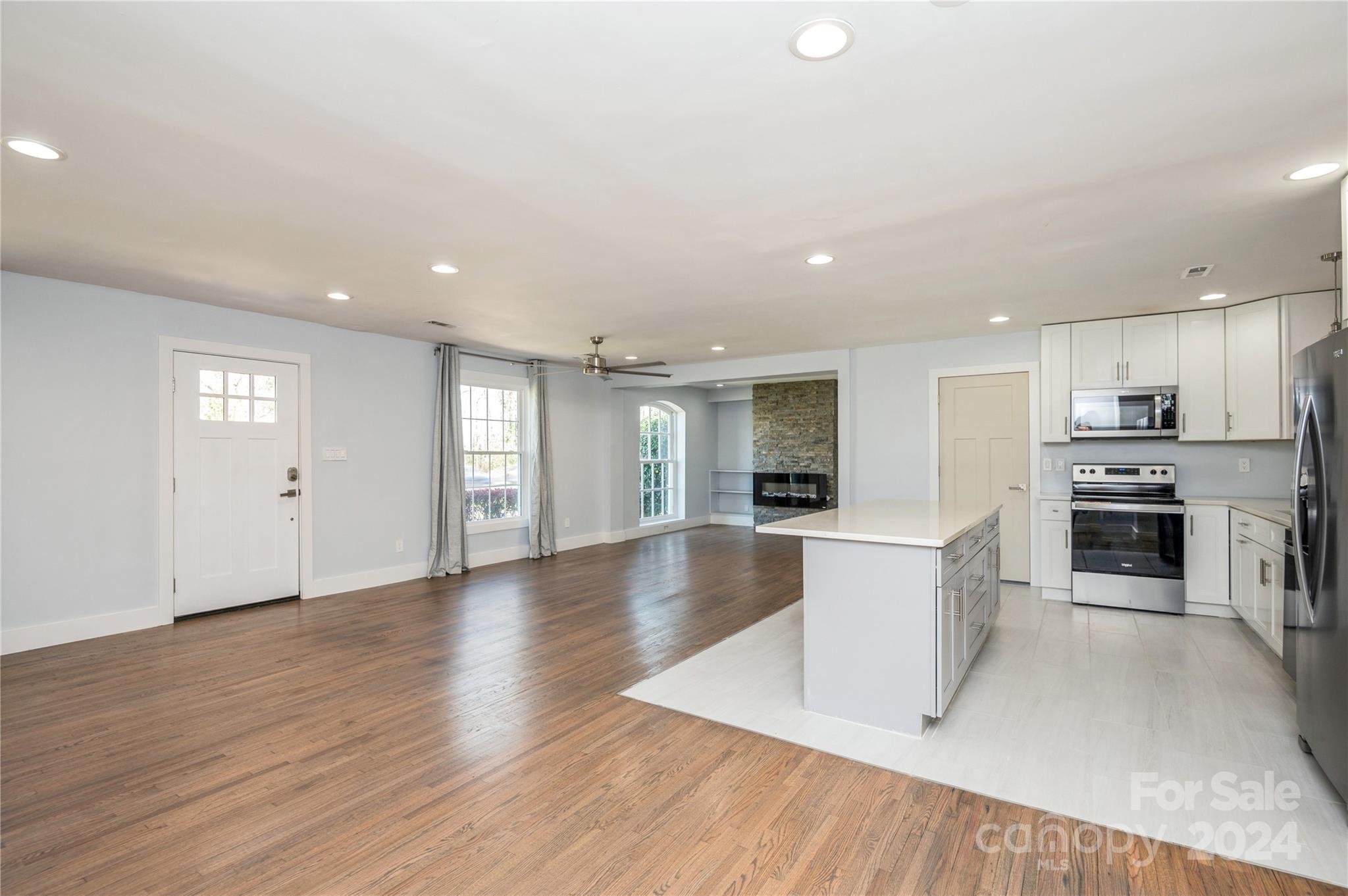 2124 Tyvola Road Charlotte, NC 28210 - Photo 19 of 38 a view of a kitchen with furniture and wooden floor