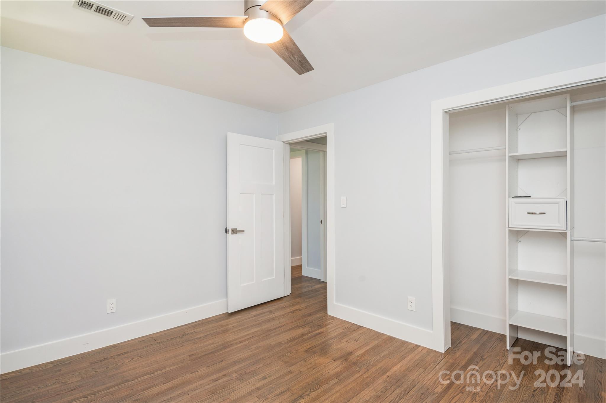 2124 Tyvola Road Charlotte, NC 28210 - Photo 27 of 38 an empty room with wooden floor