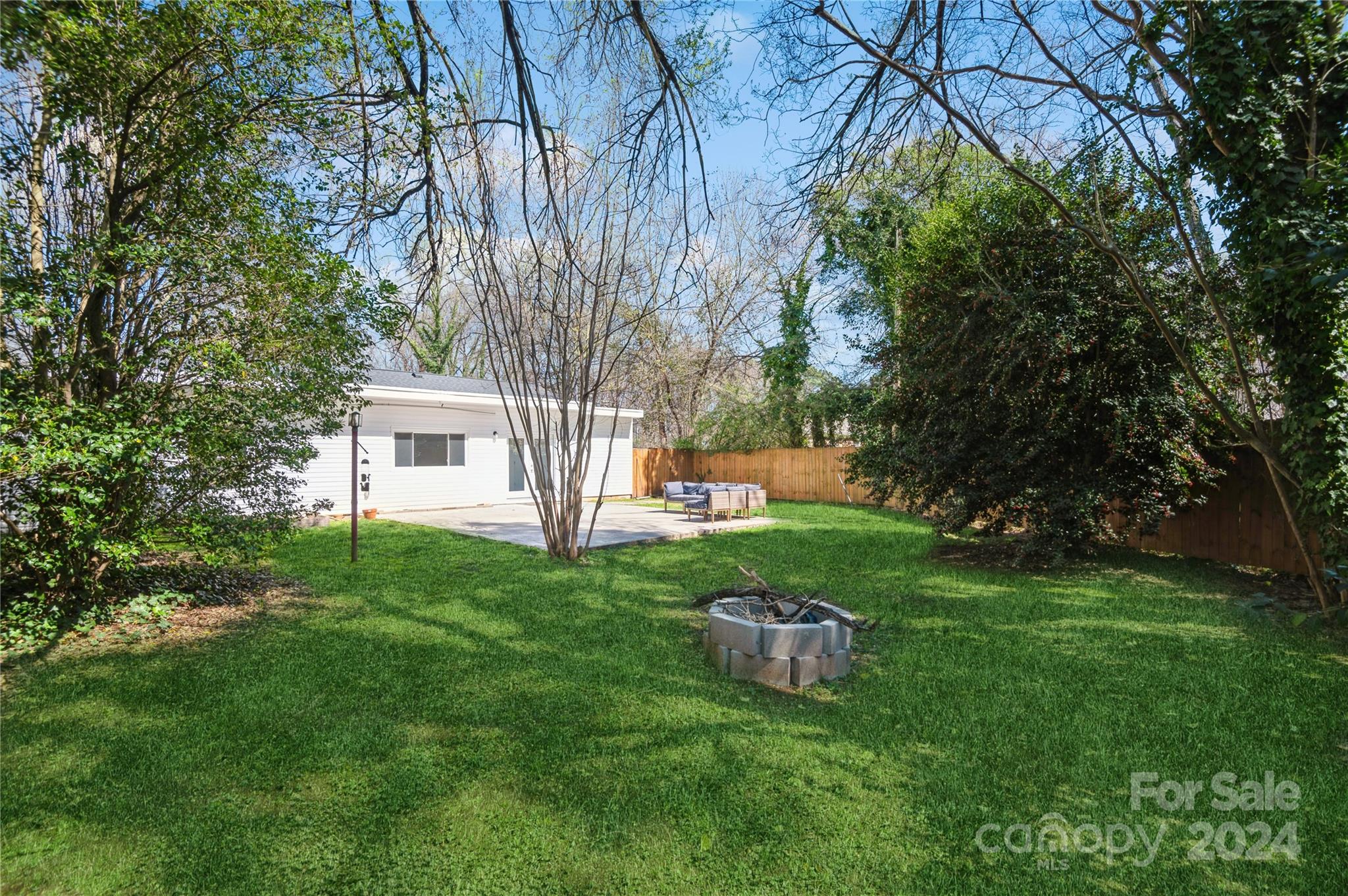 2124 Tyvola Road Charlotte, NC 28210 - Photo 35 of 38 a view of a backyard with large trees
