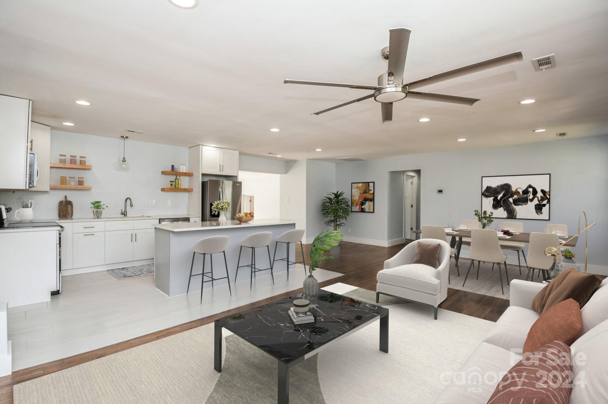2124 Tyvola Road Charlotte, NC 28210 - Photo 4 of 38 a living room with furniture and kitchen view