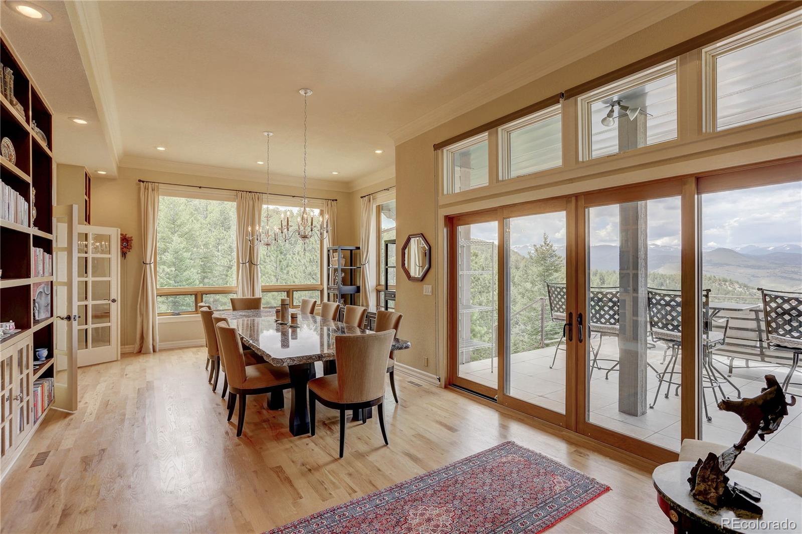 5886 Flagstaff Road Boulder, CO 80302 - Photo 14 of 37 a view of a dining room with furniture window and wooden floor