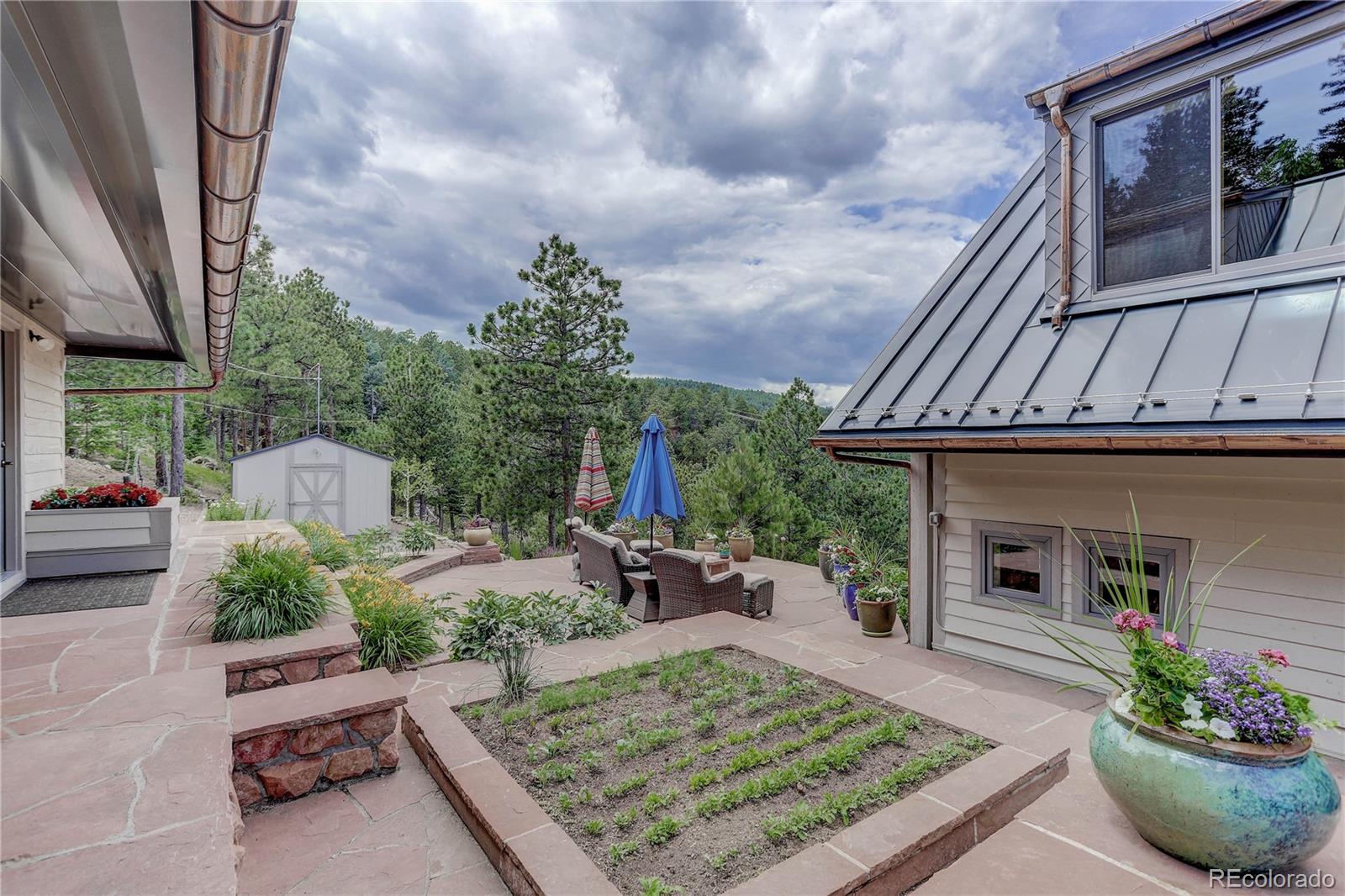 5886 Flagstaff Road Boulder, CO 80302 - Photo 32 of 37 a front view of a house with garden