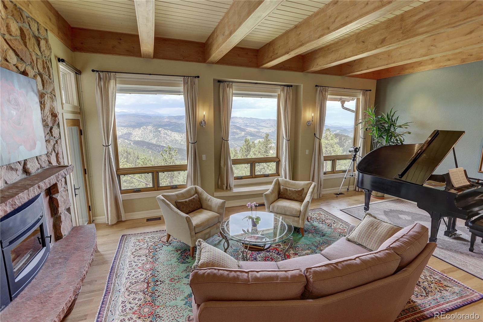 5886 Flagstaff Road Boulder, CO 80302 - Photo 7 of 37 a living room with furniture and a floor to ceiling window