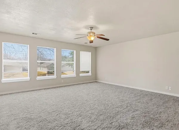 a view of an empty room with a window