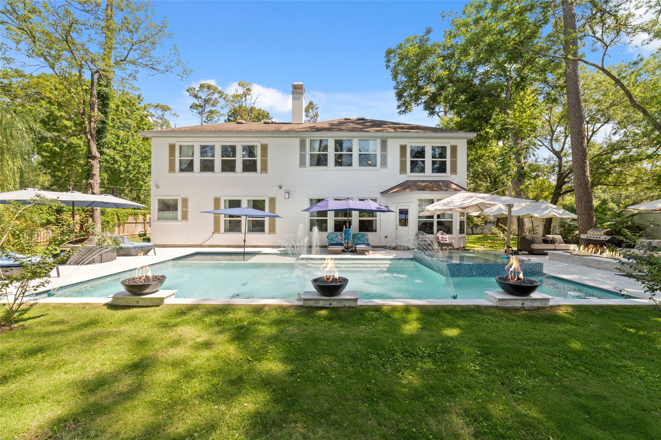 335 Voss Road Houston, TX 77024 - Photo 10 of 45 a view of a house with swimming pool and sitting area