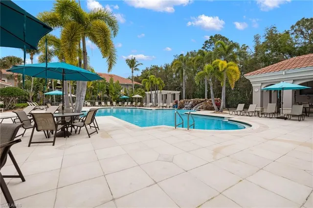 a view of a swimming pool with chairs