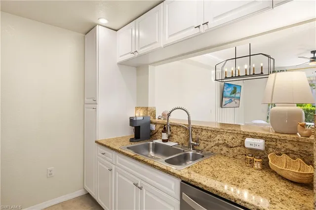 a kitchen with a sink and a stove
