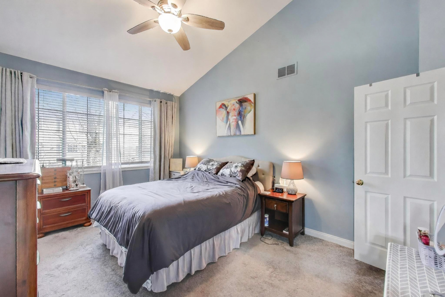 2487 Stonegate Road Algonquin, IL 60102 - Photo 11 of 39 a bedroom with a bed and a chandelier