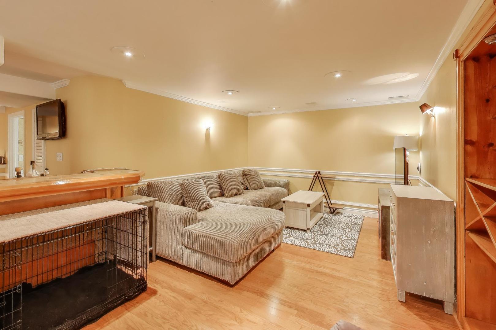 2487 Stonegate Road Algonquin, IL 60102 - Photo 30 of 39 a living room with furniture and a mirror