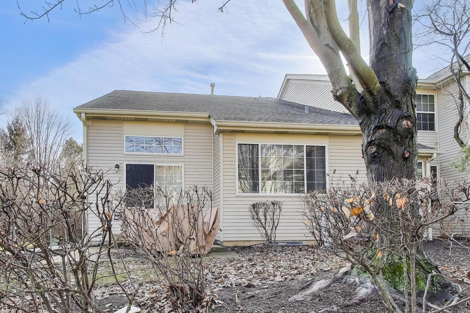 2487 Stonegate Road Algonquin, IL 60102 - Photo 33 of 39 a front view of a house with garden