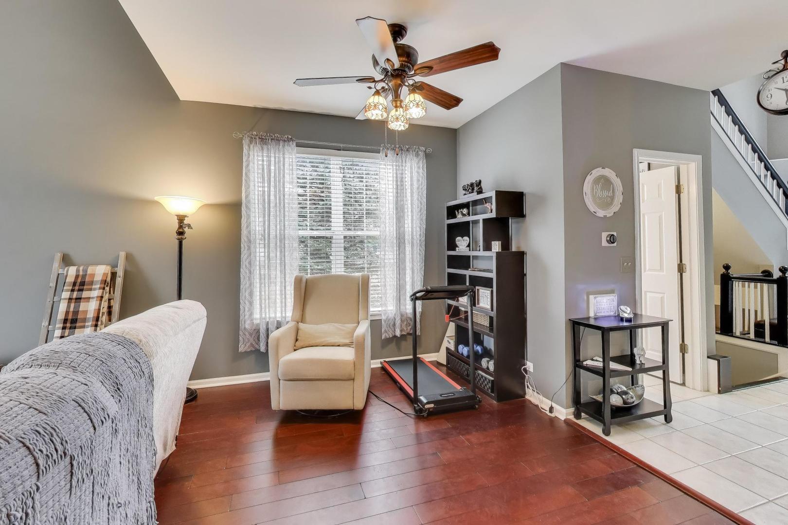 2487 Stonegate Road Algonquin, IL 60102 - Photo 9 of 39 a living room with furniture and a large window