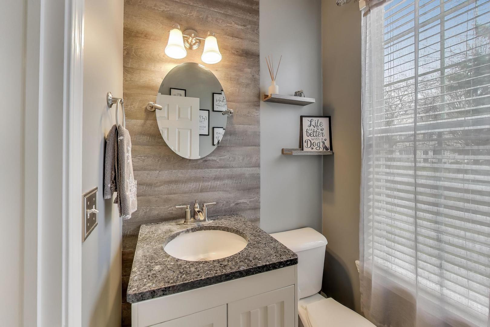 2487 Stonegate Road Algonquin, IL 60102 - Photo 10 of 39 a bathroom with a granite countertop toilet sink and mirror