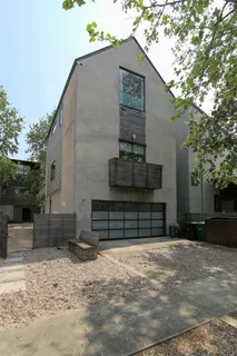 a front view of a house with garage