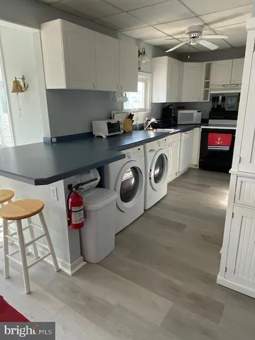 a kitchen with stainless steel appliances granite countertop a sink and a stove