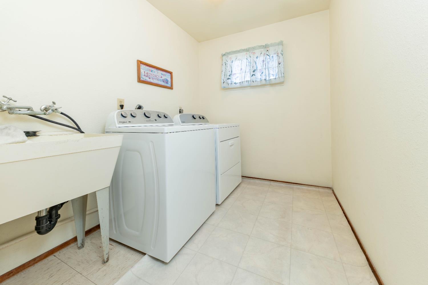 876 Daphne Lane Lemoore, CA 93245 - Photo 12 of 19 a utility room with dryer and washer
