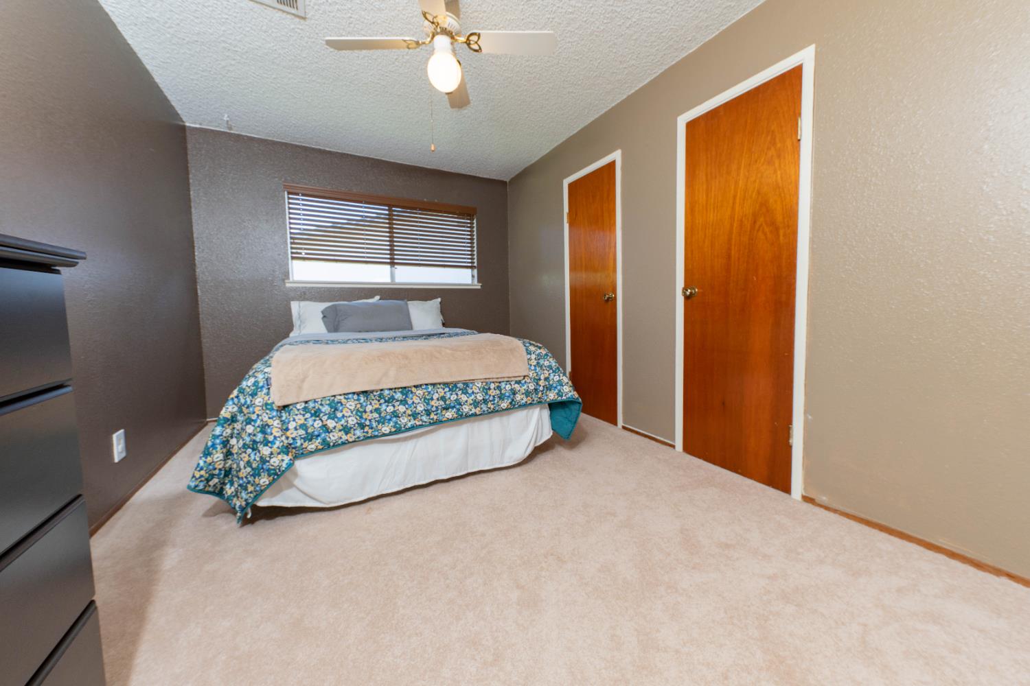 876 Daphne Lane Lemoore, CA 93245 - Photo 13 of 19 a bedroom with a bed and window