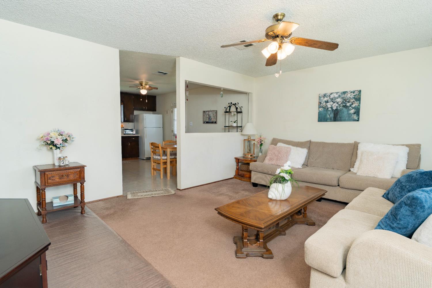 876 Daphne Lane Lemoore, CA 93245 - Photo 3 of 19 a living room with furniture and a dining table