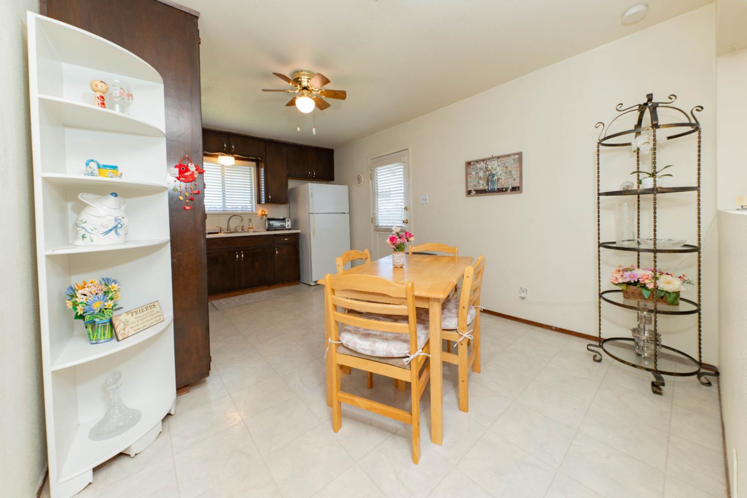 876 Daphne Lane Lemoore, CA 93245 - Photo 5 of 19 a living room with furniture and a kitchen