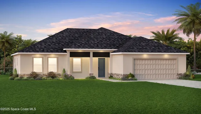 a front view of a house with a garden and plants