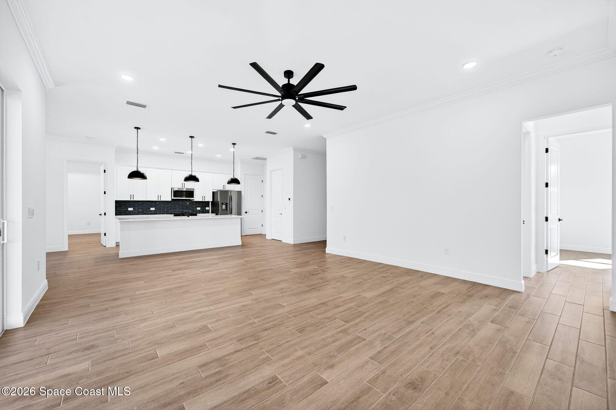 7482 Sheridan Road West Melbourne, FL 32904 - Photo 9 of 32 Great Room To Kitchen