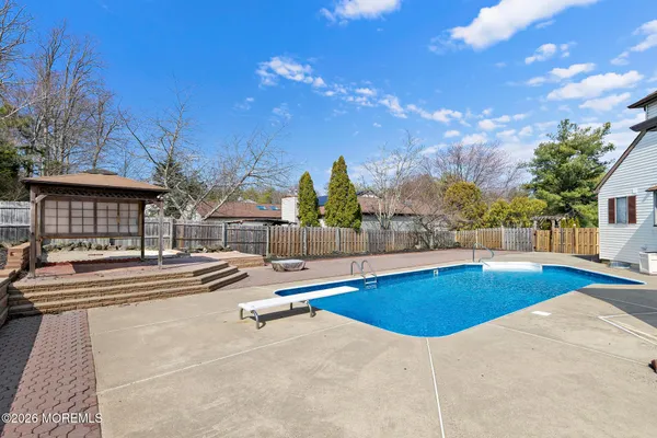 a view of a swimming pool with outdoor seating