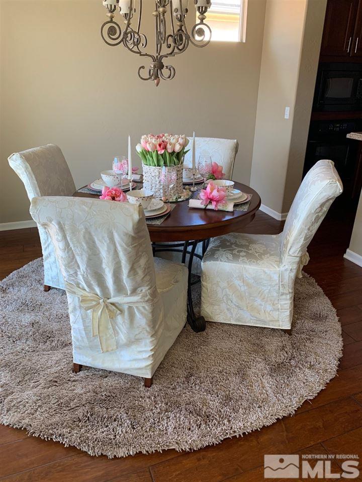 9132 Quilberry Way Reno, NV 89523 - Photo 26 of 26 a view of dining room with furniture and wooden floor