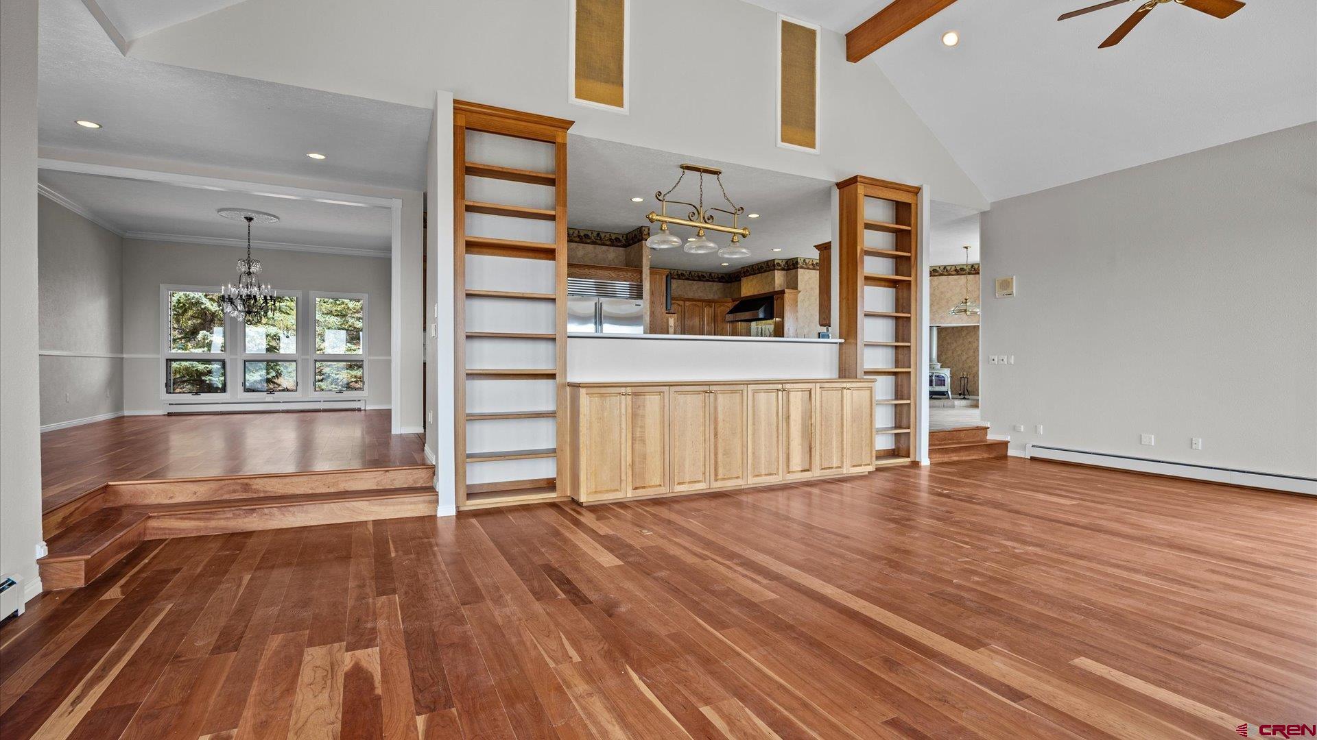 20508 Green Valley Road Cedaredge, CO 81413 - Photo 14 of 42 wooden floor in an empty room with a window
