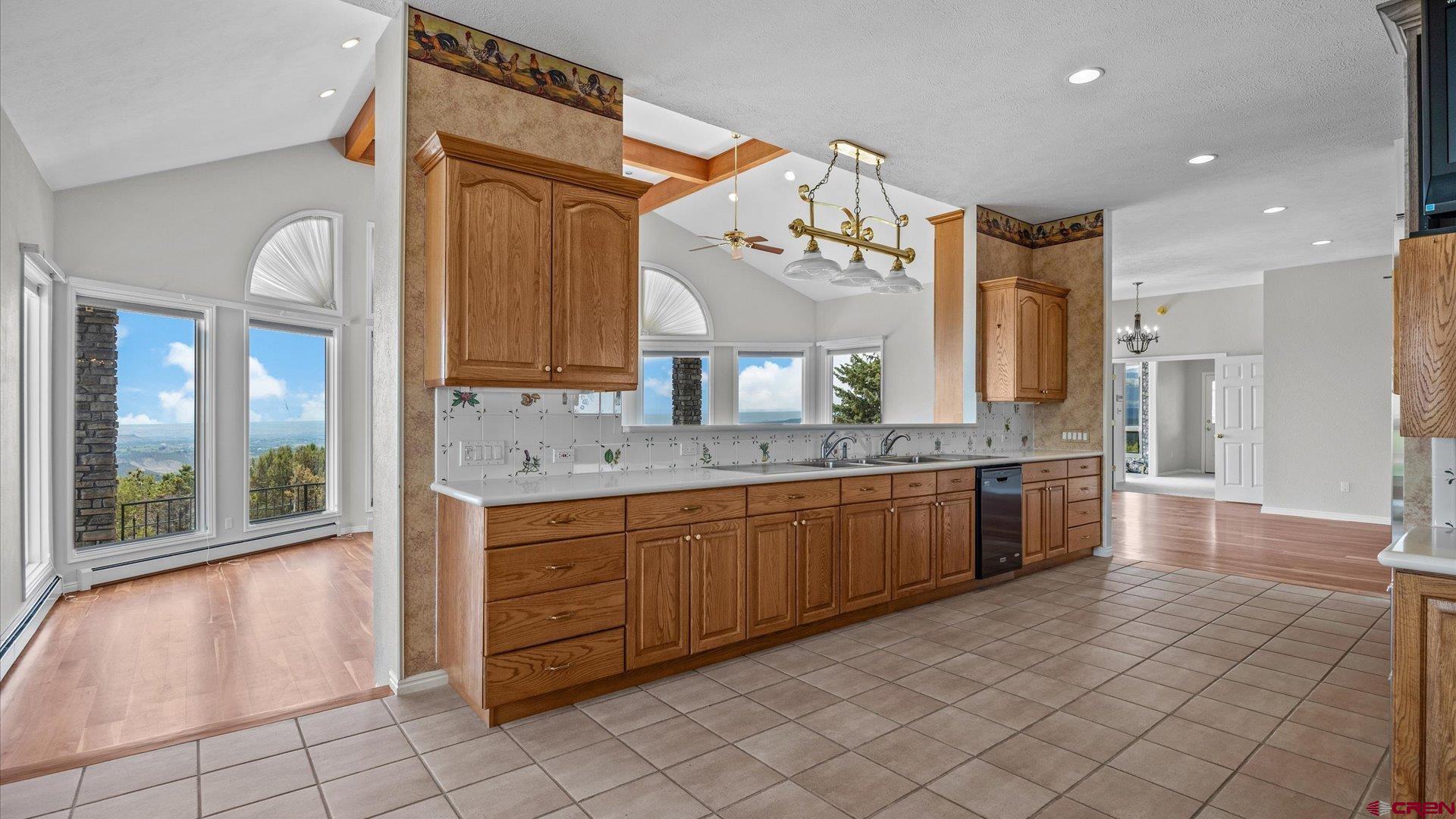 20508 Green Valley Road Cedaredge, CO 81413 - Photo 16 of 42 a large bathroom with a large mirror vanity and sink
