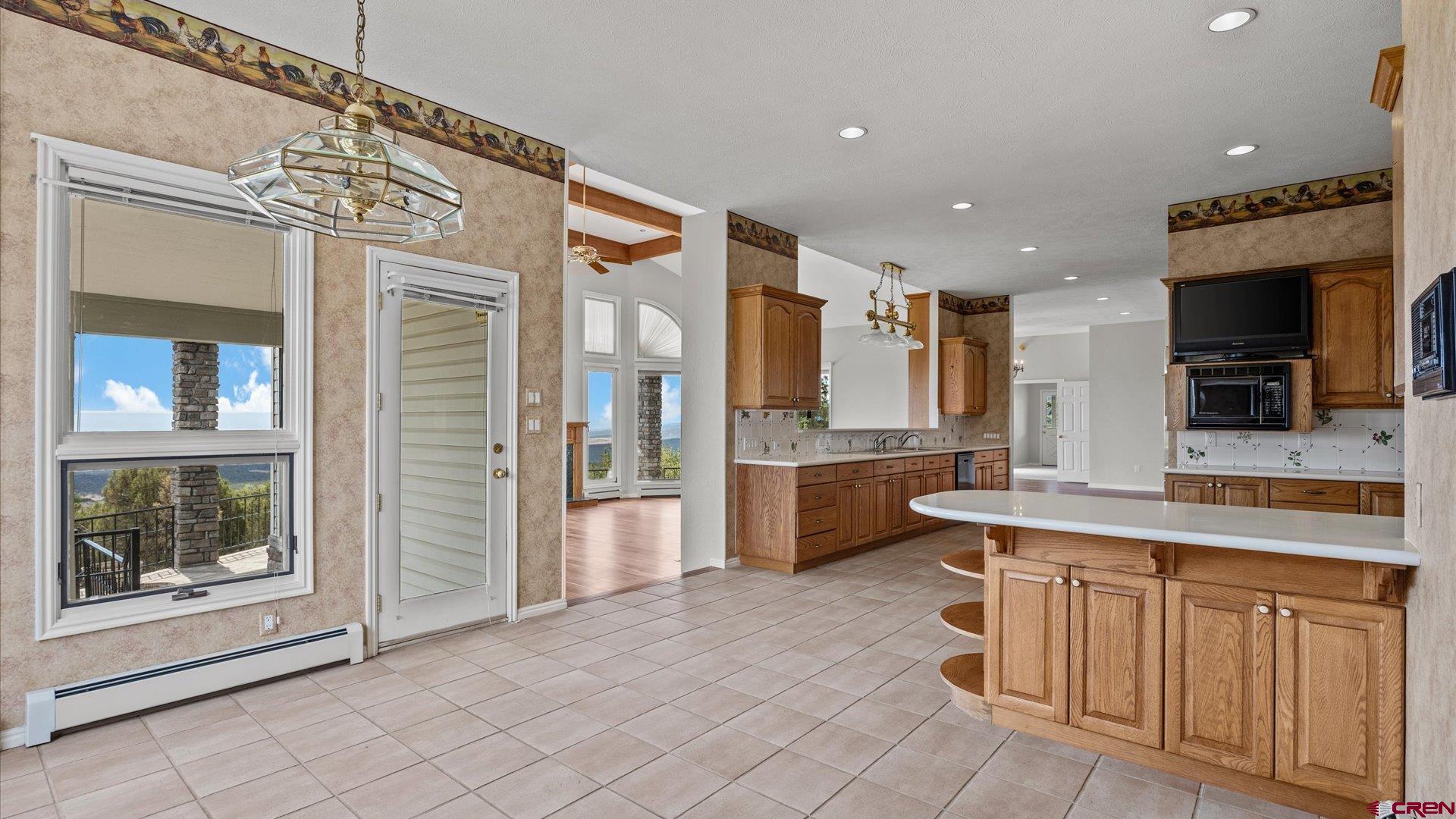 20508 Green Valley Road Cedaredge, CO 81413 - Photo 19 of 42 a open kitchen with a sink and cabinets