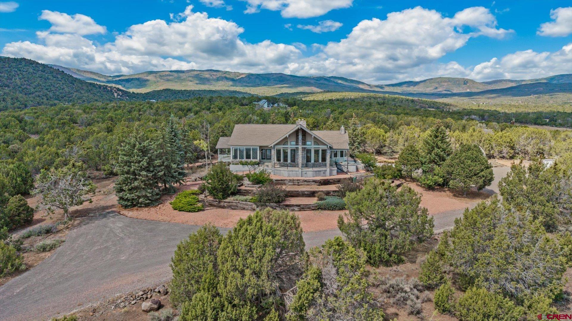 20508 Green Valley Road Cedaredge, CO 81413 - Photo 2 of 42 a view of a lake with a garden